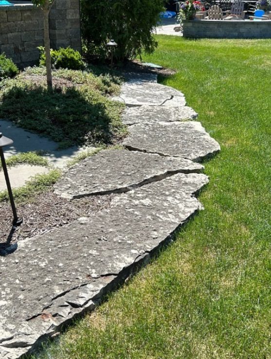 Natural stone paver path dull and weathered before cleaning