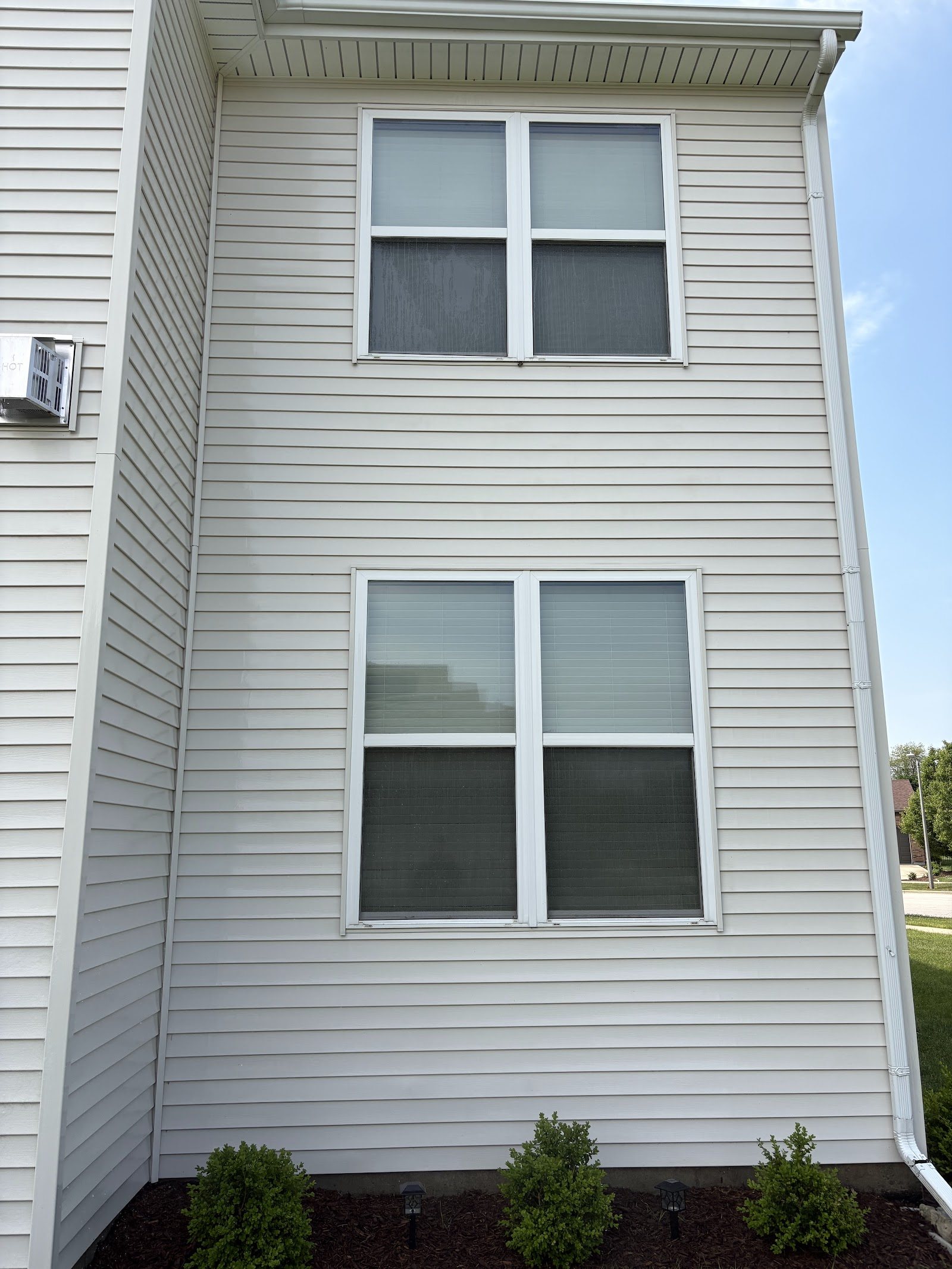 Same home siding after professional soft wash, bright and clean